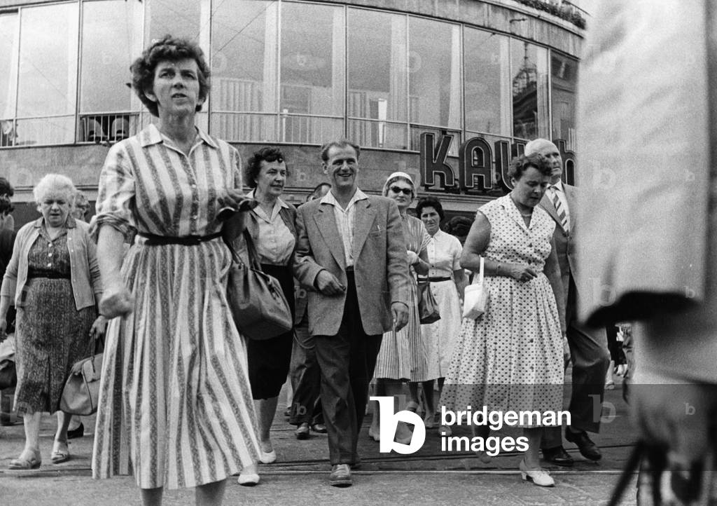 Pedestrians at the Karlsplatz in Munich (b/w photo)