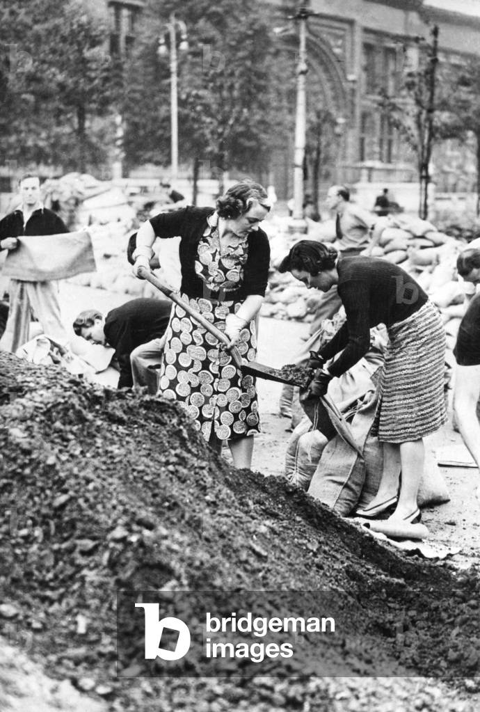 Women filling sandbags in London, 1939 (b/w photo)
