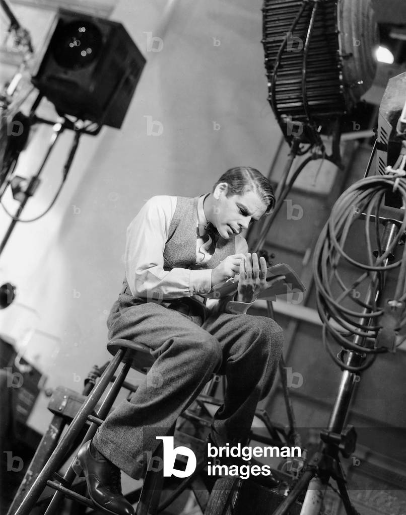Paul Muni during the filming of 'Hi, Nellie', 1934 (b/w photo)