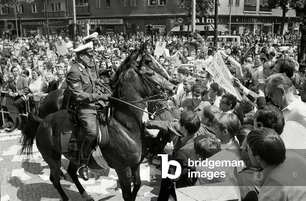 Mounted police push back demonstrators in Berlin, 1967 (b/w photo)
