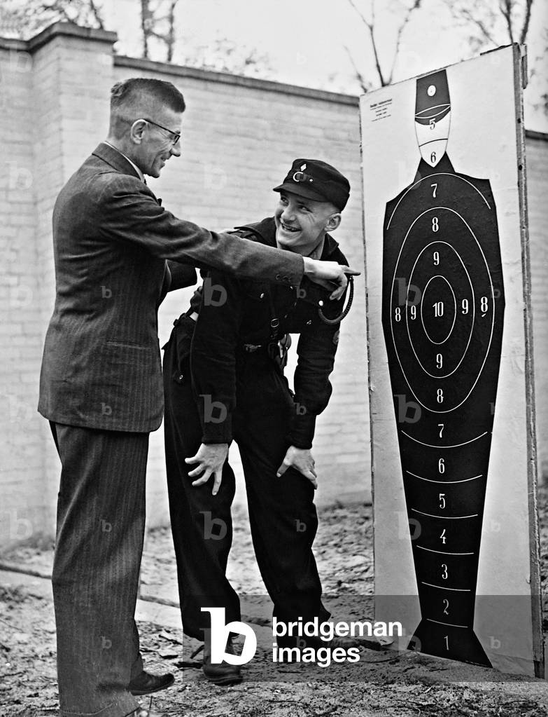 Hitler Youth member receives a shooting lesson, 1939 (b/w photo)