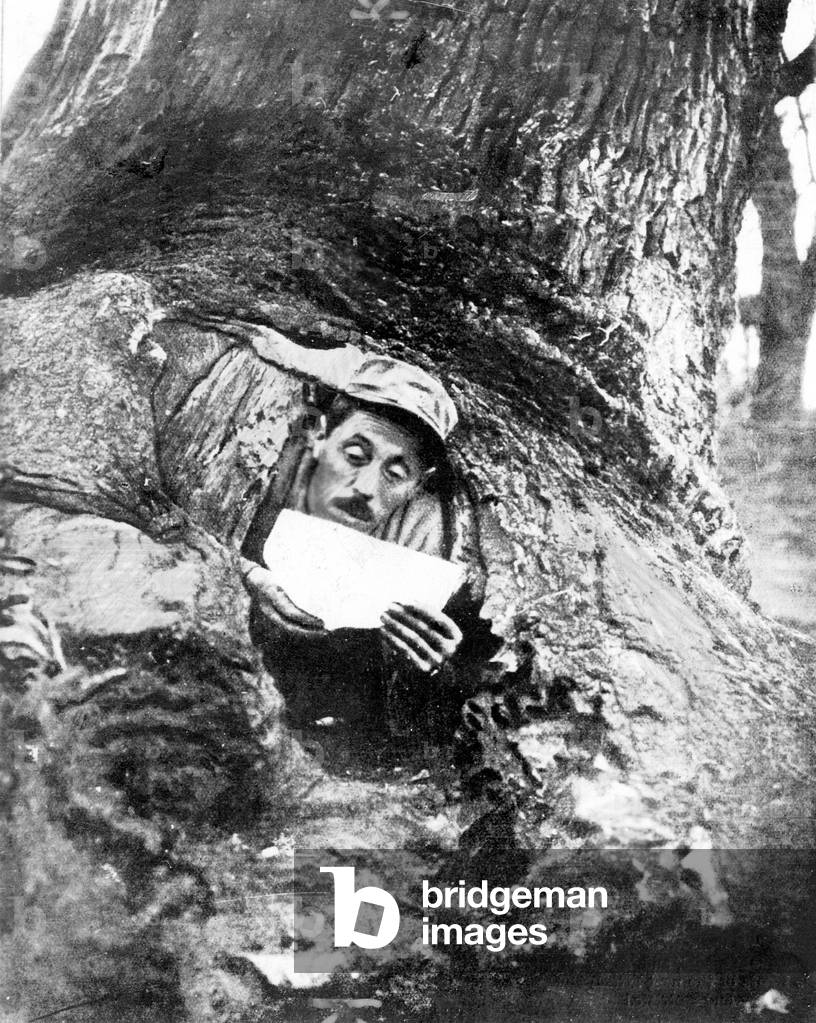 French soldier in his shelter, 1917 (b/w photo)