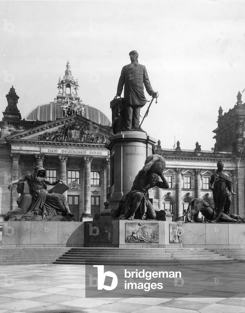 The Reichstag building with the Bismarck monument by Reinhold Begas in front, Berlin, Germany, 1931 (b/w photo)