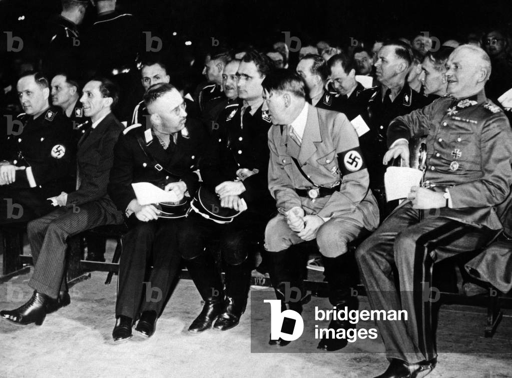 Himmler in conversation with Hitler during an SS concert, 1934