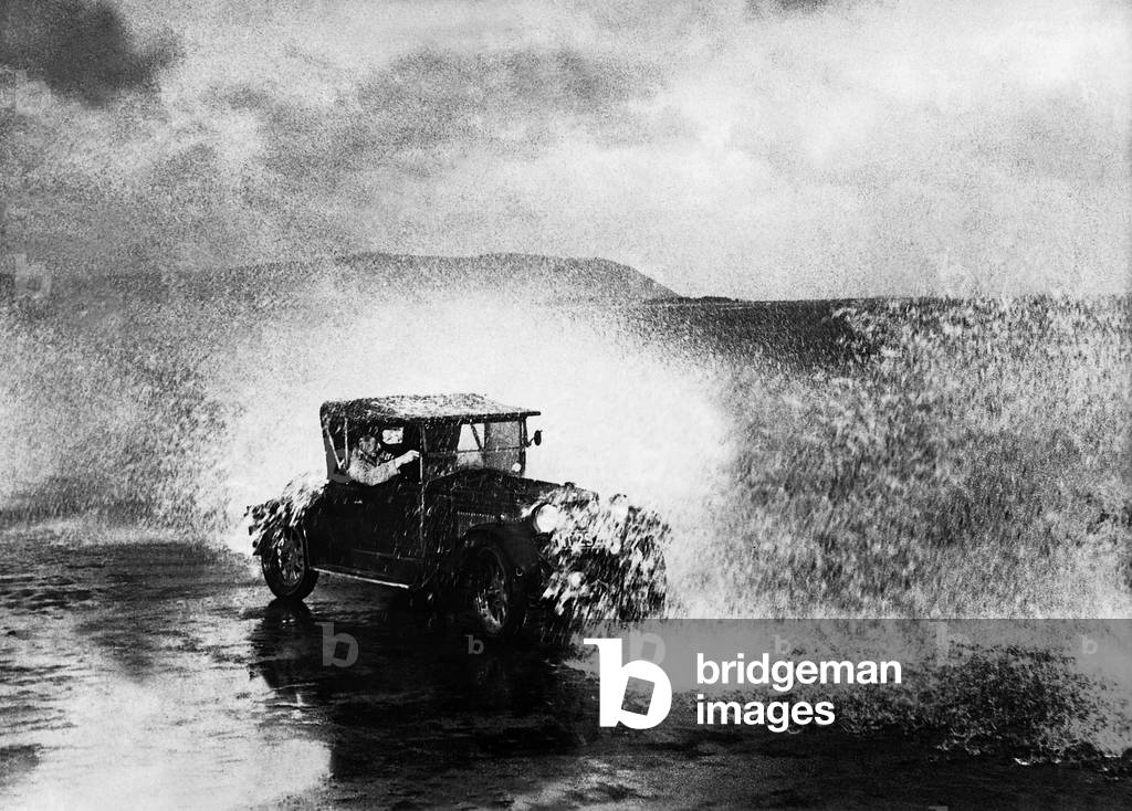 Car in bad weather (b/w photo)
