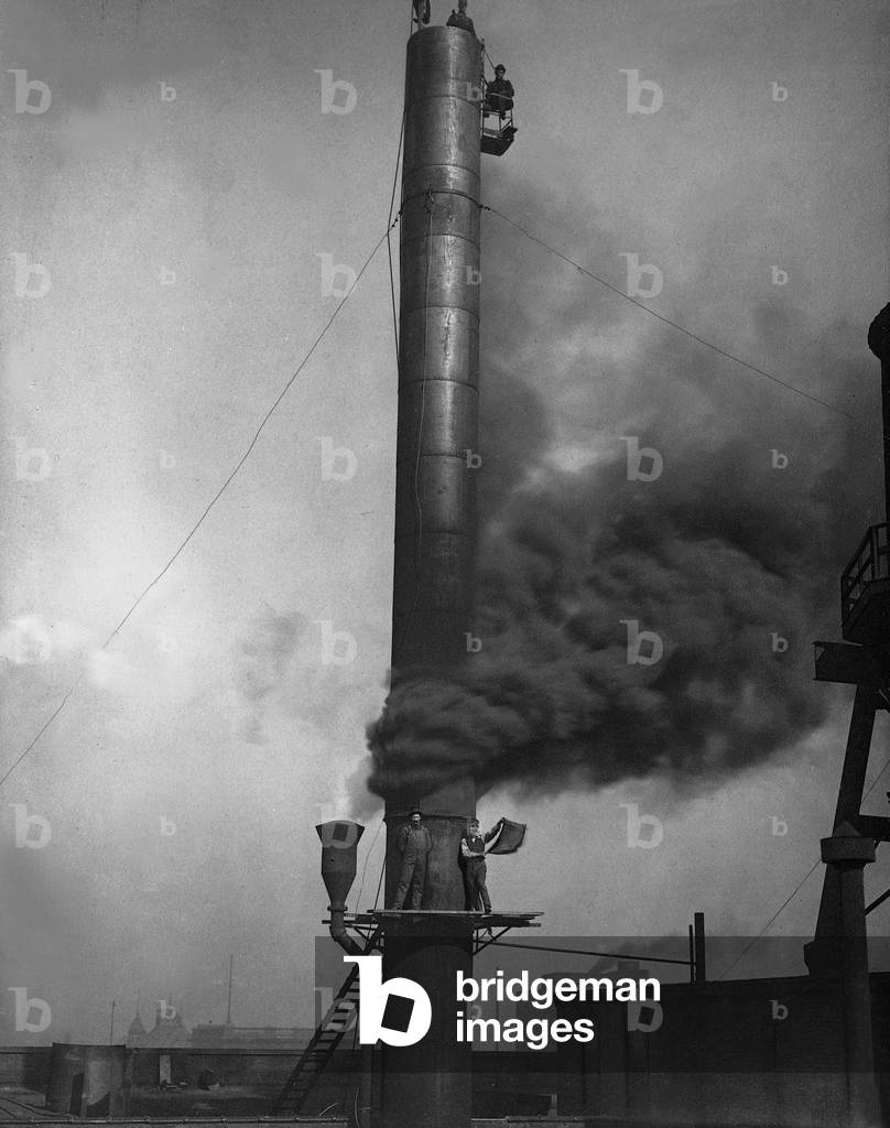 Smoking chimney of a factory in Indianapolis, 1904 (b/w photo)