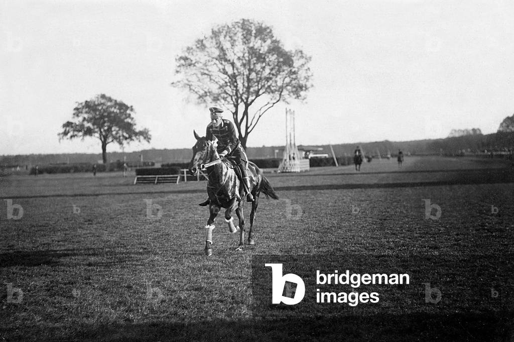 Jockey during a horse race, 1910 (b/w photo)