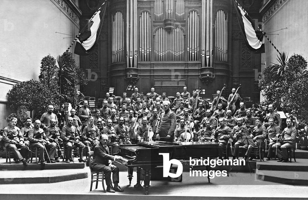 Eugen d'Albert at a grand piano, 1916 (b/w photo)