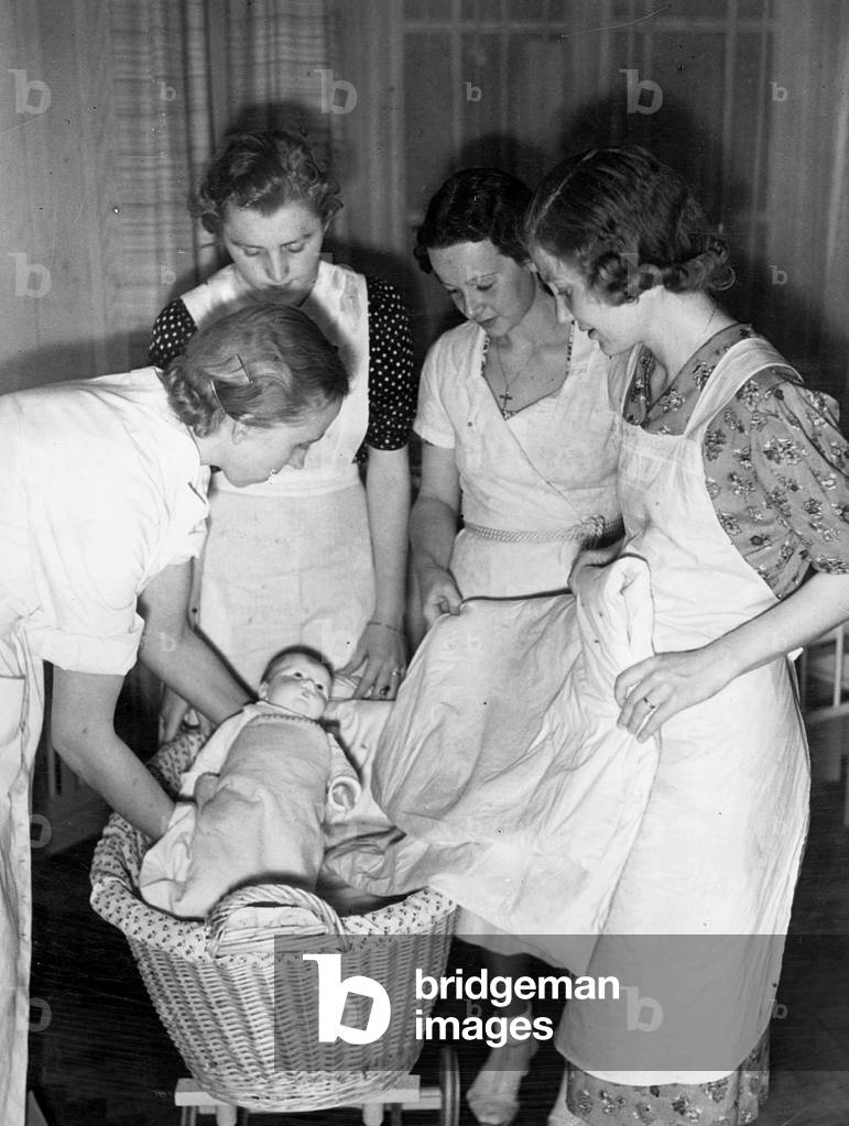 Infant care at the Reich Bridal School, Schwanenwerder, 1938 (b/w photo)