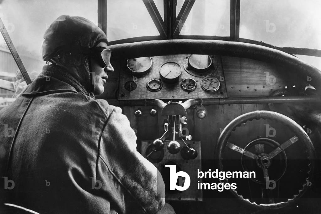 Pilot in a cockpit of a passenger airplane by Fokker, 1926 (b/w photo)