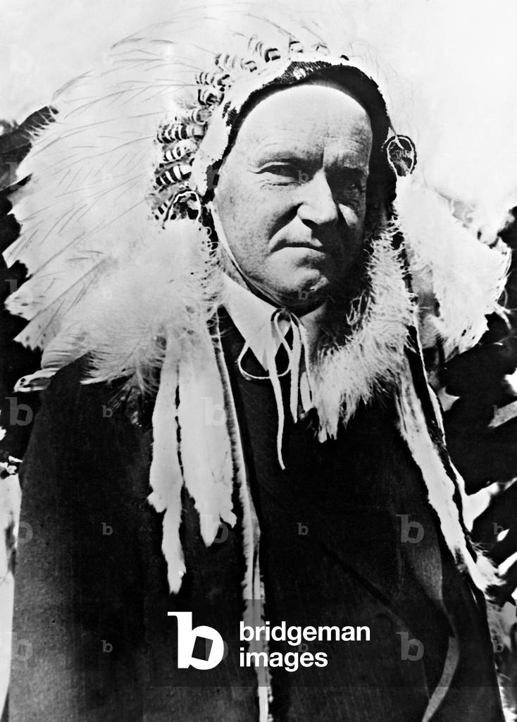 Calvin Coolidge with Indian ornament (b/w photo)