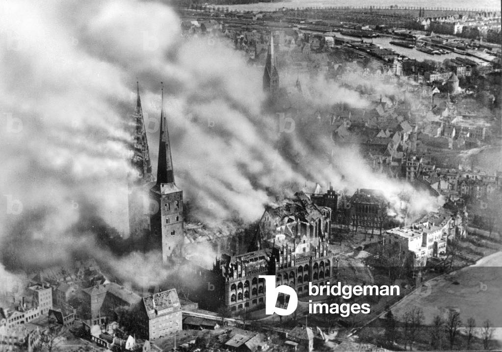 The burning Lübeck Cathedral during an air raid on 28th March, 1942 (b/w photo)