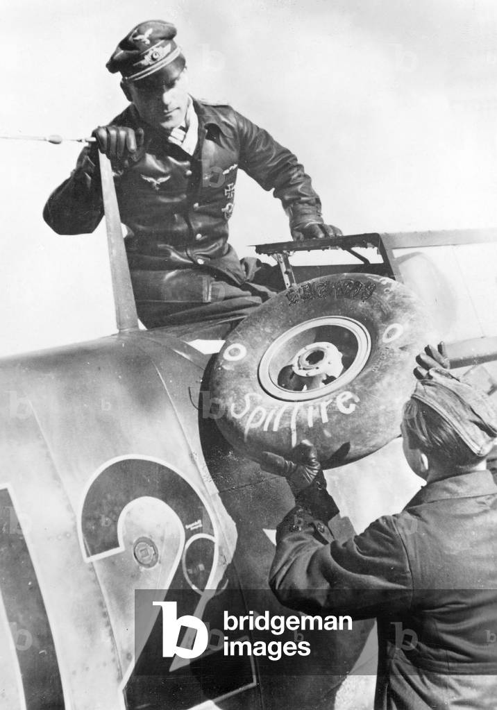 German Pilot is Climbing out of his Plane, 1942 (b/w photo)