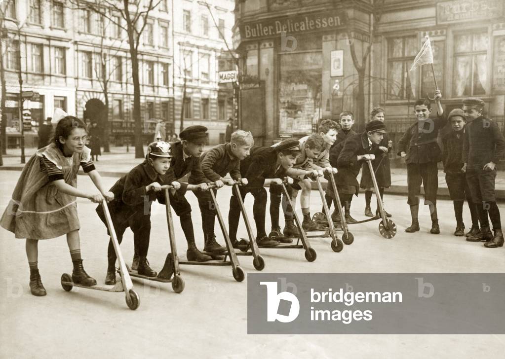 Children at a scooter race, 1922 (b/w photo)