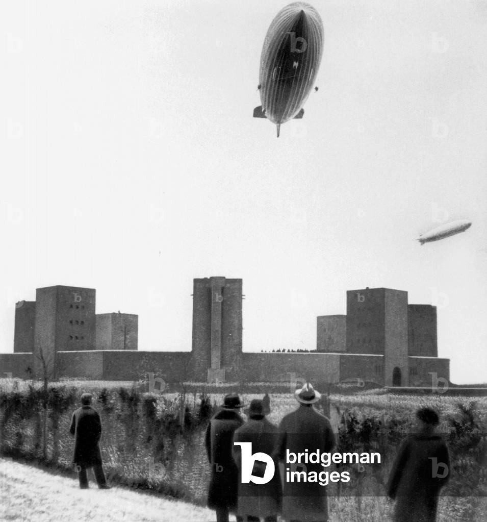 The airships 'Graf Zeppelin' and 'Hindenburg' above the Tannenberg Memorial, 1936 (b/w photo)