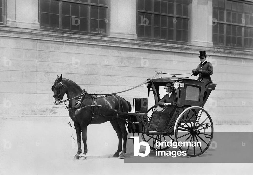 The only two-wheeled horse-drawn carriage, called a Hansom, in Vienna, Austria, 1904 (b/w photo)