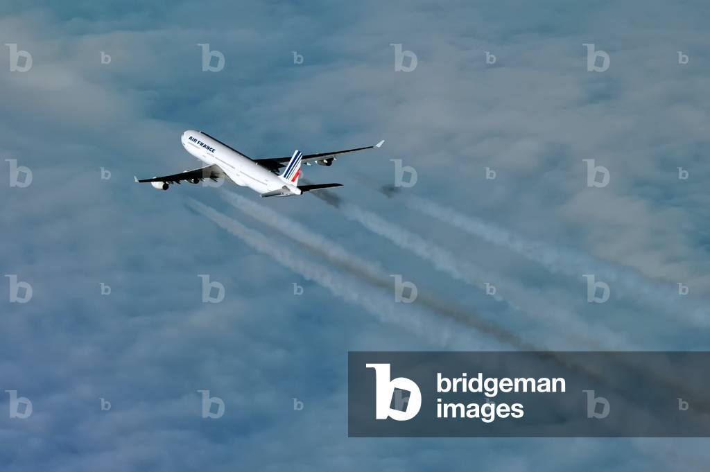 Condensation trails of a Air France Airbus A340 over the clouds, Germany, 2013 (photo)