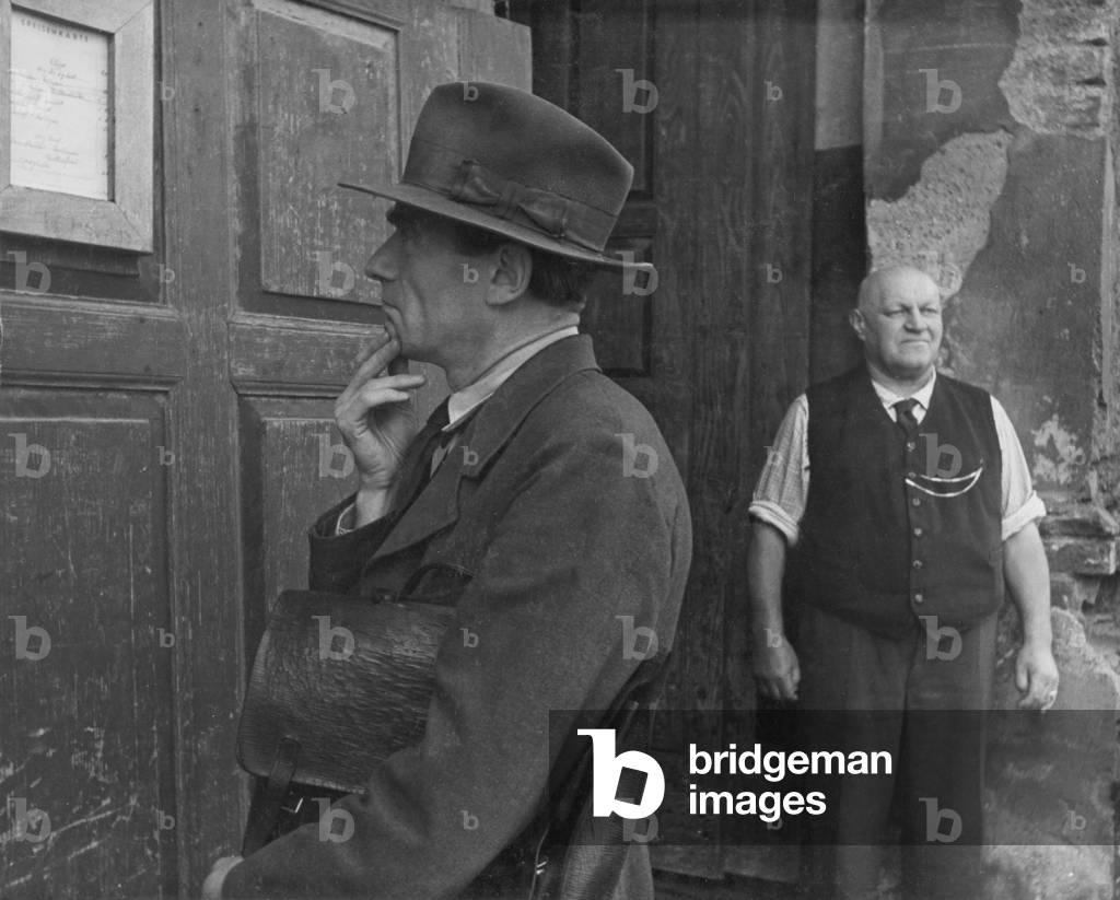 Man reading a menu (b/w photo)