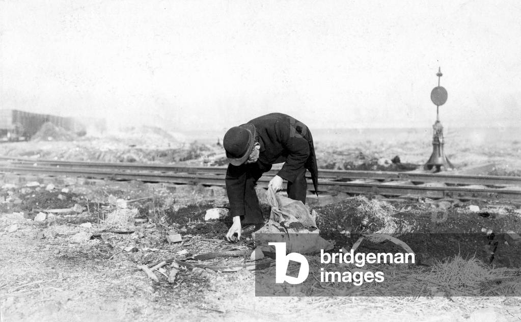 Tramp at the outskirts of a big city (b/w photo)