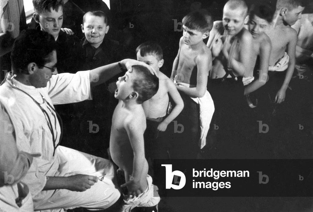 Medical examination in the Children's Home, 1930 (b/w photo)
