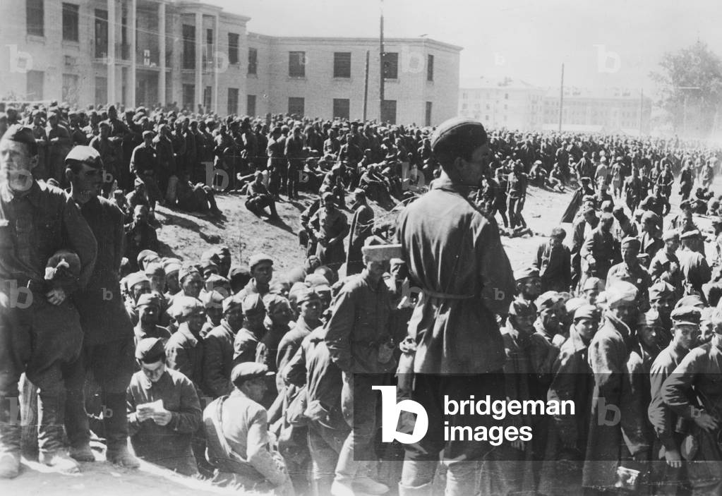 Soviet prisoners of war in a German collection camp on the Eastern front, 1942 (b/w photo)