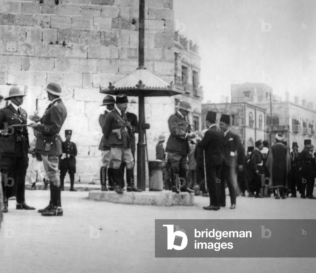 British soldiers at an Arab procession through Jerusalem, 1930 (b/w photo)