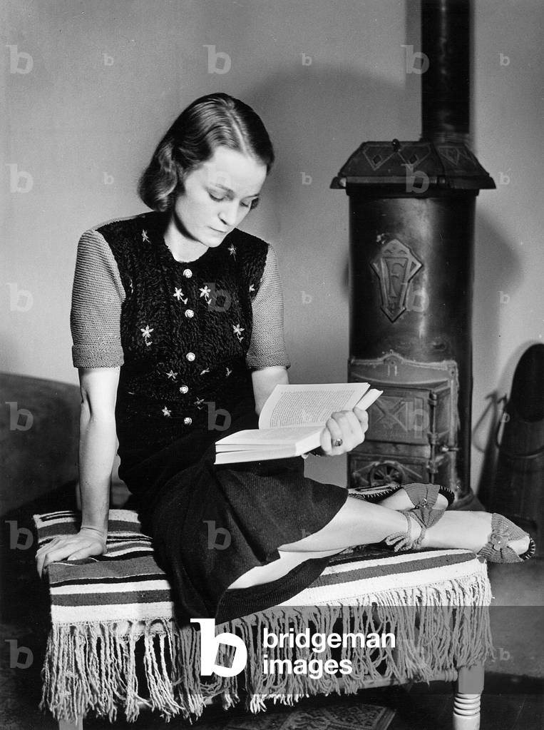 Young woman reading, 1938 (b/w photo)