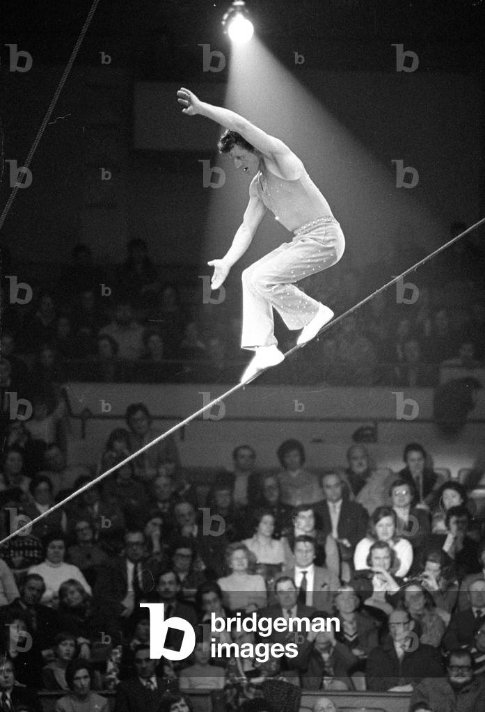 Tightrope artist in the circus, 1974 (b/w photo)