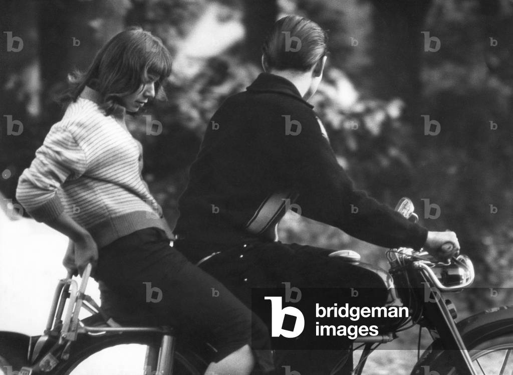 Teenagers on a motorbike, 1958 (b/w photo)