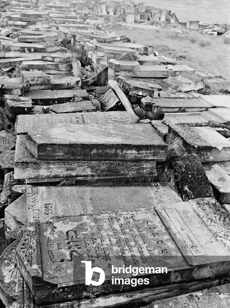 Grave stones of a leveled Jewish cemetery (b/w photo)