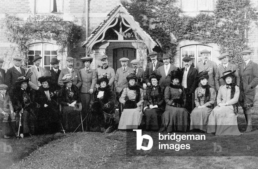 Kaiser Wilhelm II (in the middle in hunting uniform) during a visit to England, group shot of the hunting party of Humphrey Sturt, 2nd Lord Alington, 1907 (b/w photo)