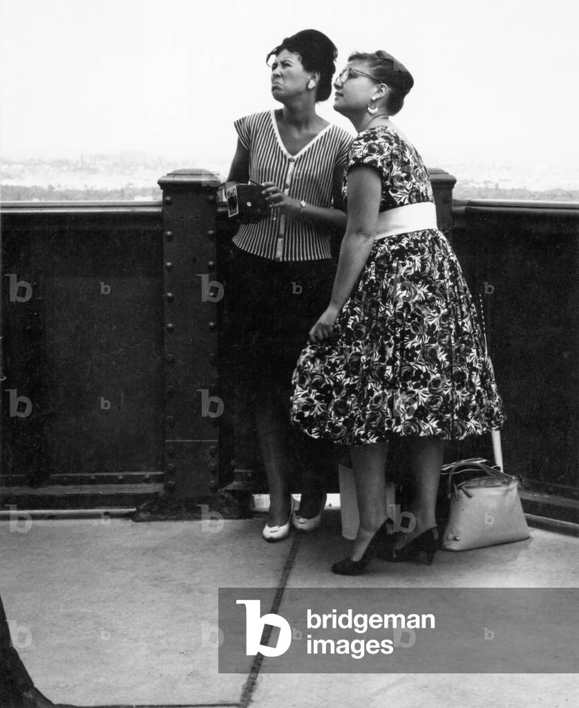 Two women on the Eiffel Tower, 1960 (b/w photo)