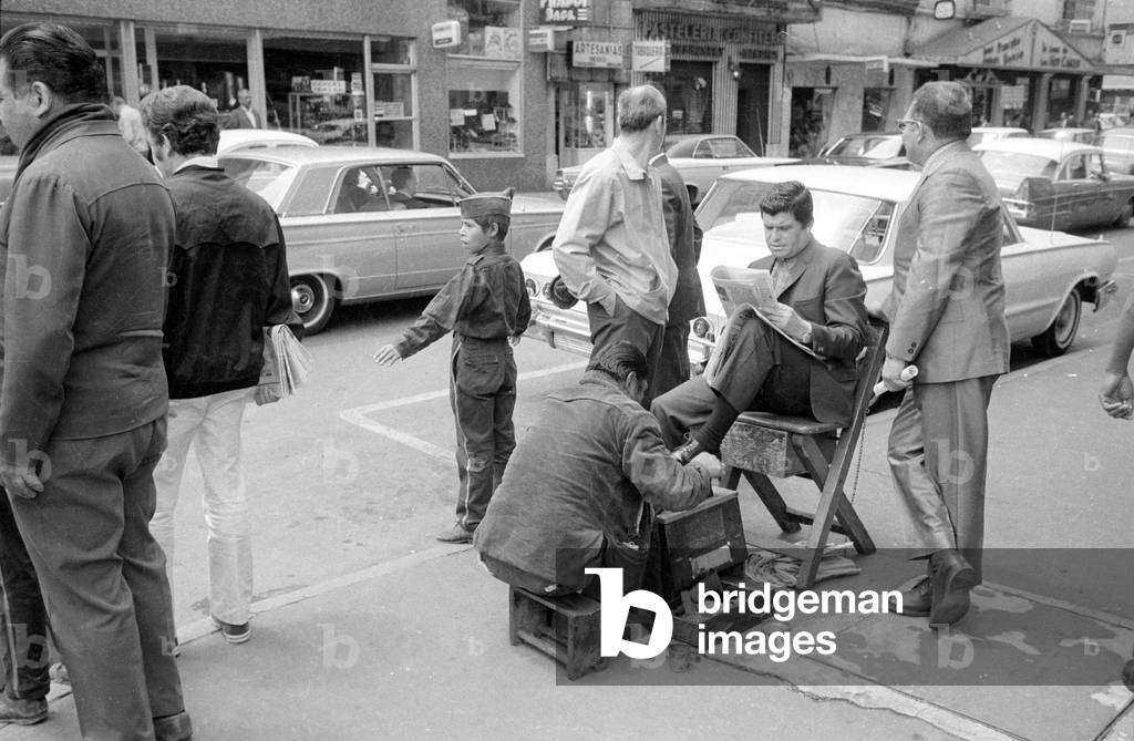 Shoe polisher in Mexico City, 1970 (b/w photo)
