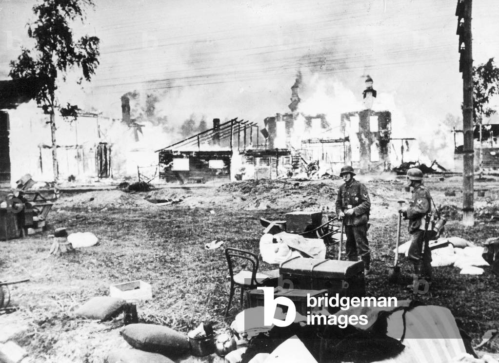 Soldiers in the ruins of a russian city, 1941 (b/w photo)