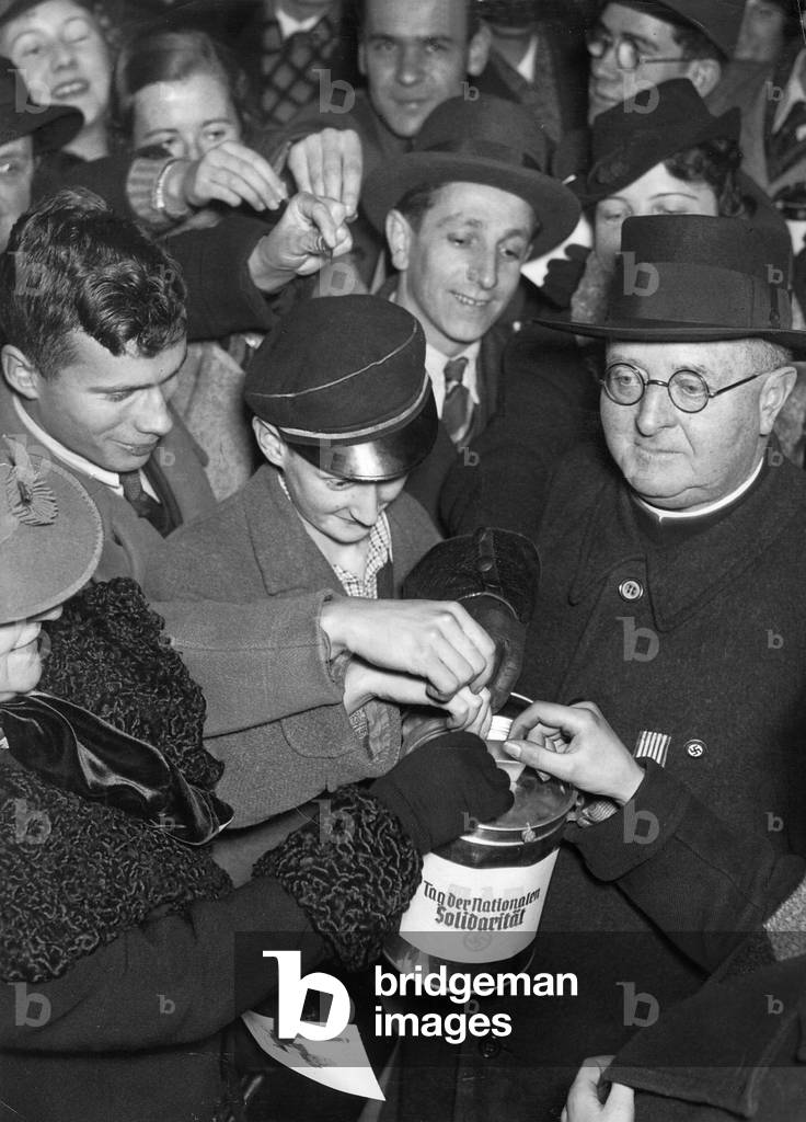A Catholic priest gathered on the 'Day of National Solidarity', 1936 (b/w photo)