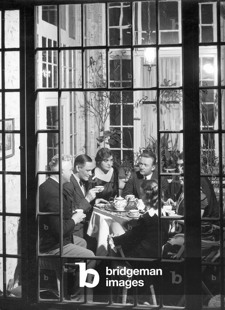 Drinking coffee, 1934 (b/w photo)