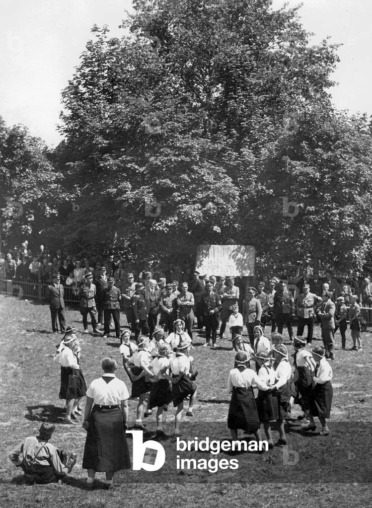 Village girls dance in front of Rudolf Hess, 1935 (b/w photo)