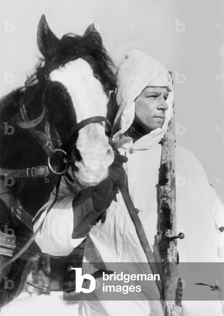German soldier with a Panje horse, 1942 (b/w photo)