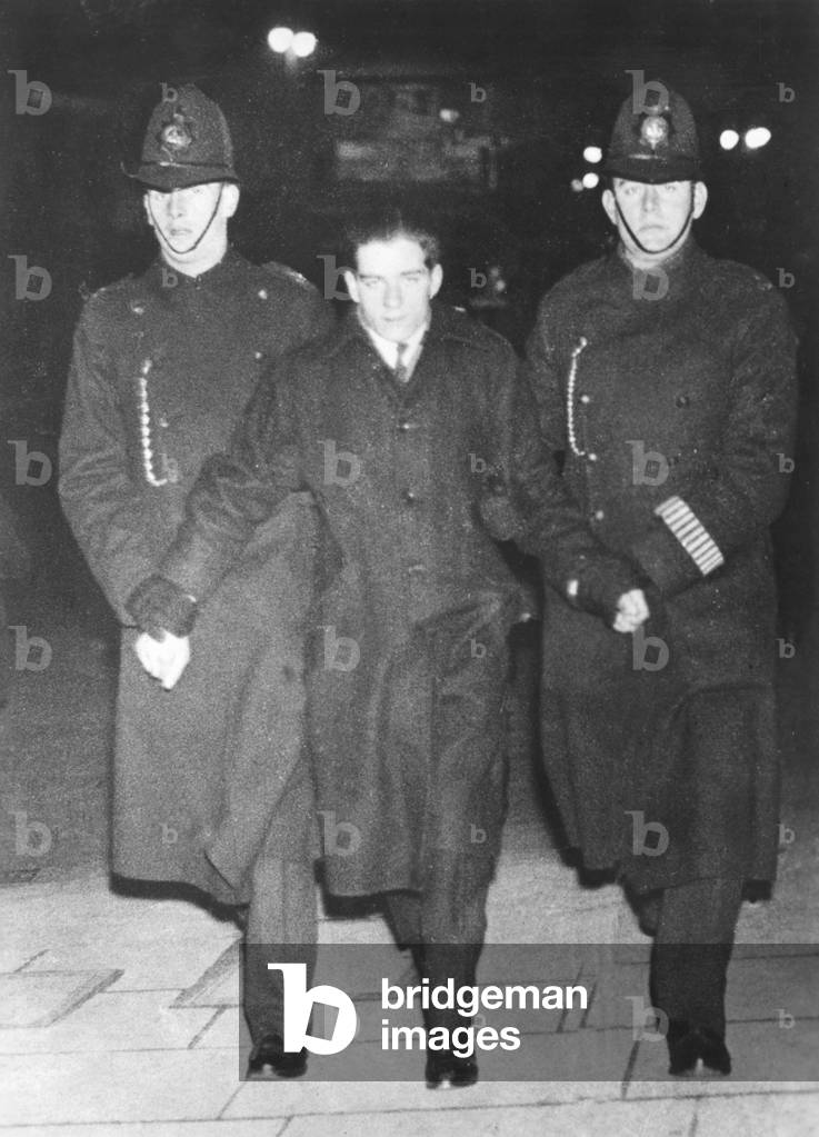 Policemen taking a demonstrator away in London, 1930s (b/w photo)
