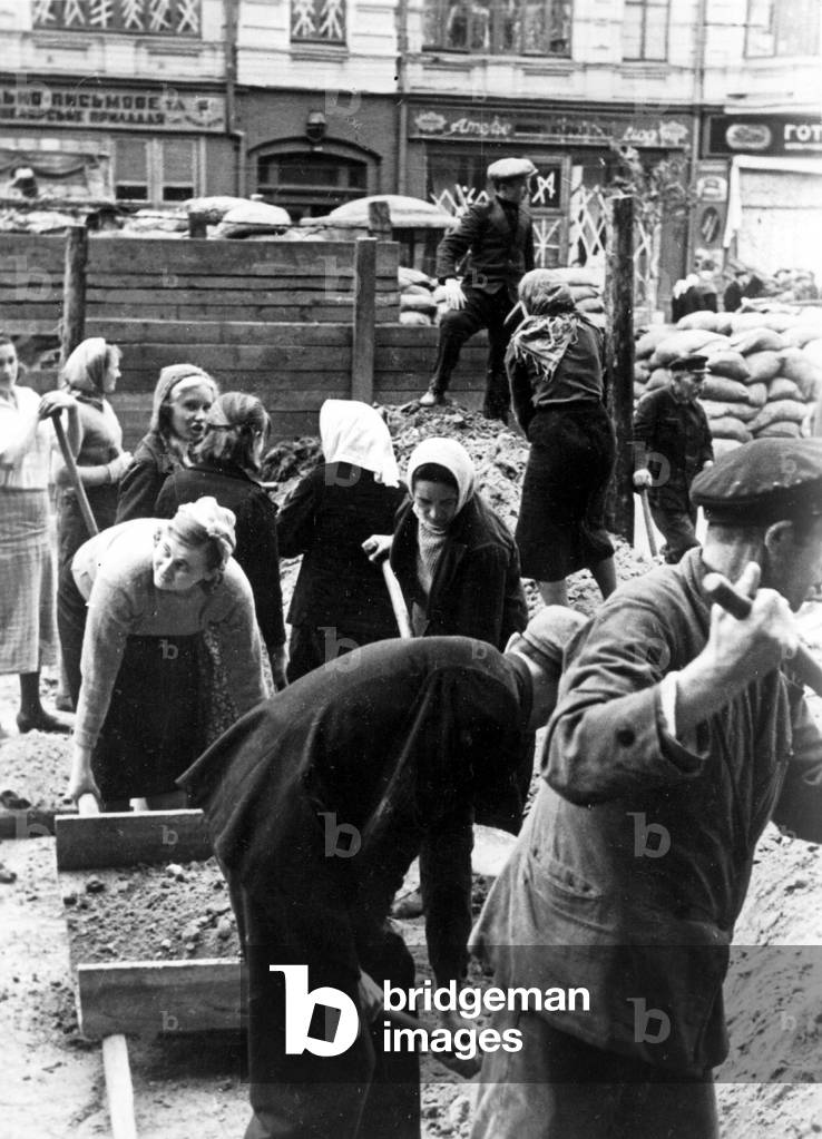 Residents of Kiev removing barricades, 1941 (b/w photo)