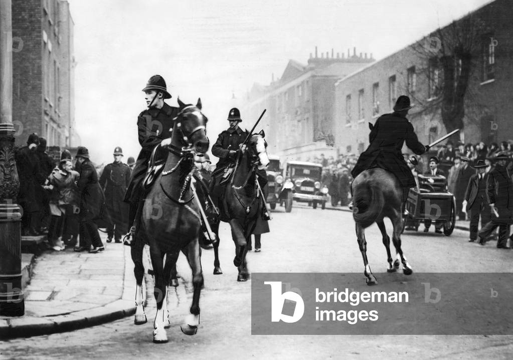 Mounted police officers at a demonstration in London, 1930s (b/w photo)