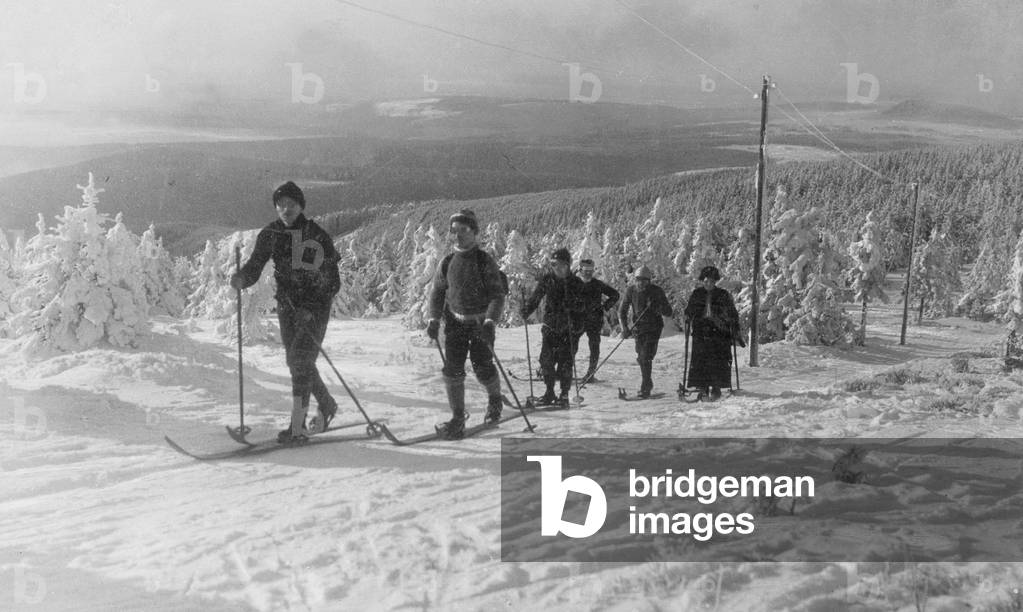 Ski tourists in the Ore Mountains (b/w photo)