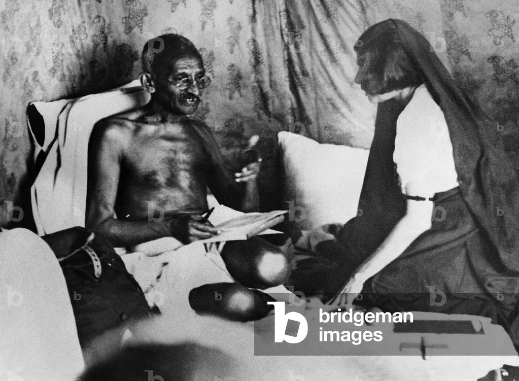 Mahatma Gandhi gives Mrs. Perin directions shortly before his arrest, 1932 (b/w photo)