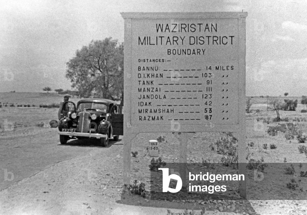 Road sign in the Waziristan region of British India, 1937 (b/w photo)