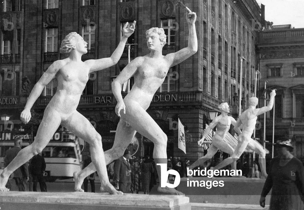 Sculptures of athletes in front of the Hotel Adlon in Berlin (b/w photo)