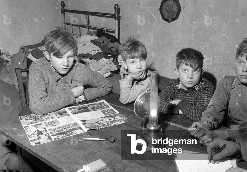 Refugee family in their home near Muenster, 1978 (b/w photo)