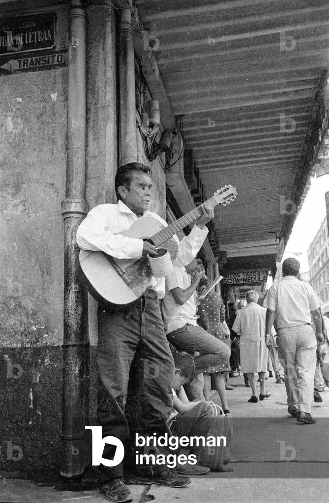 Street musician in Mexico City, 1970 (b/w photo)