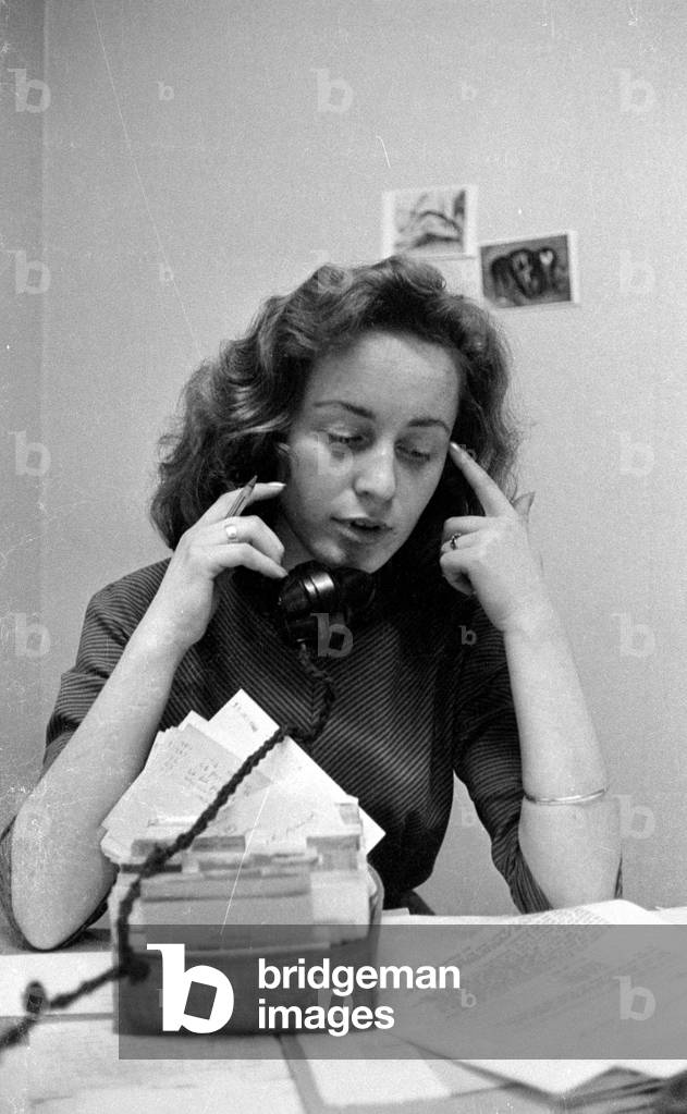 Woman on the phone in London, 1960 (b/w photo)