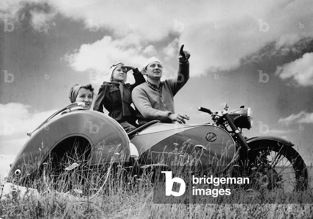 Family trip on a motorcycle with sidecar, 1951 (b/w photo)