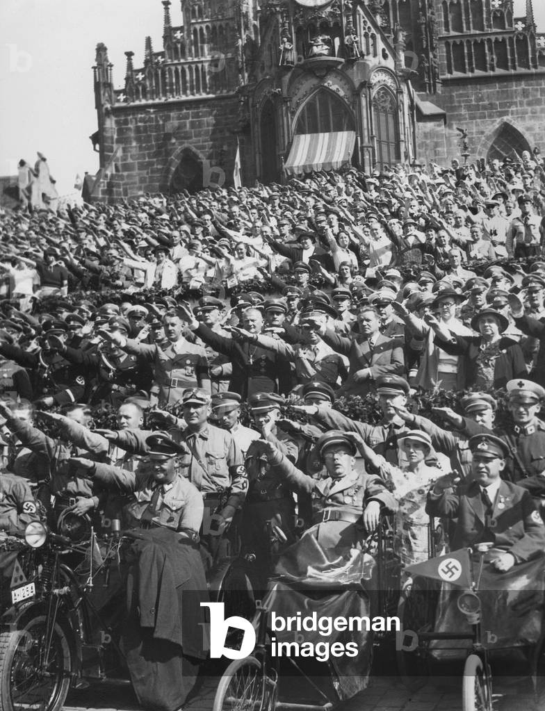 Reich Bishop Ludwig Muller among the cheering spectators in the old town of Nuremberg, 1934 (b/w photo)